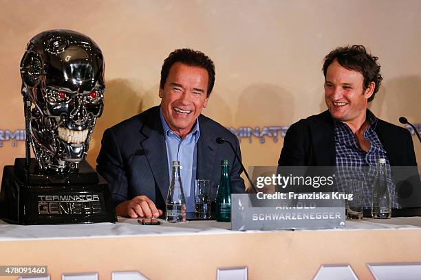 Arnold Schwarzenegger and Jason Clarke attend the international press conference of 'Terminator Genisys' on June 22 2015 in Berlin, Germany.