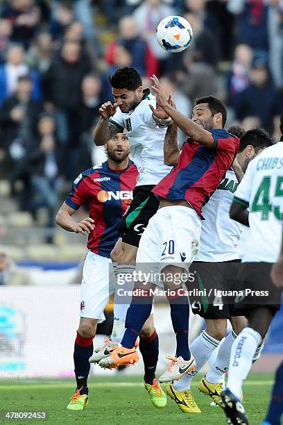 Pedro Mendes of US Sassuolo Calcio competes the ball with Barreto Ibson of Bologna FC during the Serie A match between Bologna FC and US Sassuolo...