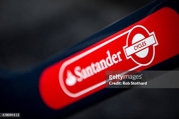 Detail of the branding of a Santander Cycles bicycle parked in a docking station in central London on June 22, 2015 in London, England. Spanish bank...