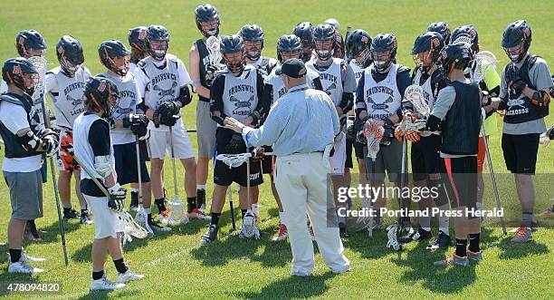 The Brunswick lacrosse coach Don Glover speaks with his players during practice Thursday, June 18, 2015.