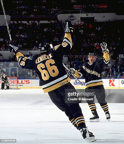 Mario Lemieux of the Pittsburgh Penguins celebrates his hat trick with his 500th career goal during the game against the New York Islanders on...