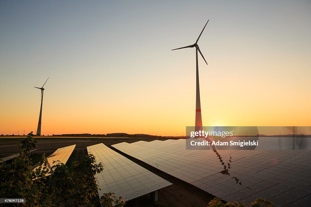 Renewable energy: wind turbines and modern solar panels