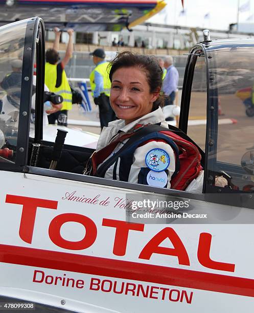 Pilot Dorine Bourneton celebrates after taking part in the first worldwide aerobatic show performed by a paraplegic woman, at the Paris Air Show 2015...