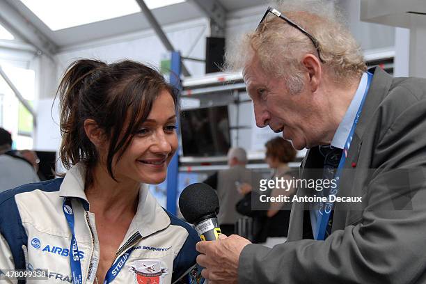 Pilot Dorine Bourneton is interviewed by the former pilot Gerard Feldzer, before taking part in the first worldwide aerobatic show performed by a...