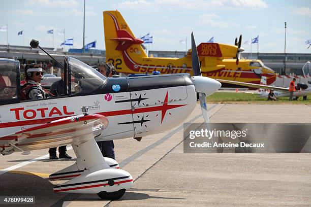 Pilot Dorine Bourneton waits for the clearance from the air traffic control on the parking before taking part in the first worldwide aerobatic show...