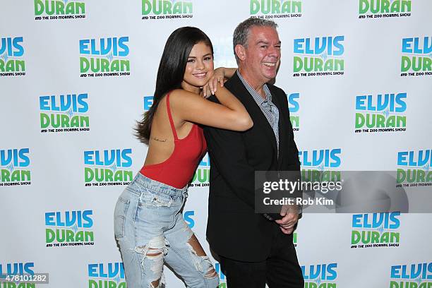 Selena Gomez poses with host Elvis Duran at "The Elvis Duran Z100 Morning Show" at Z100 Studio on June 22, 2015 in New York City.