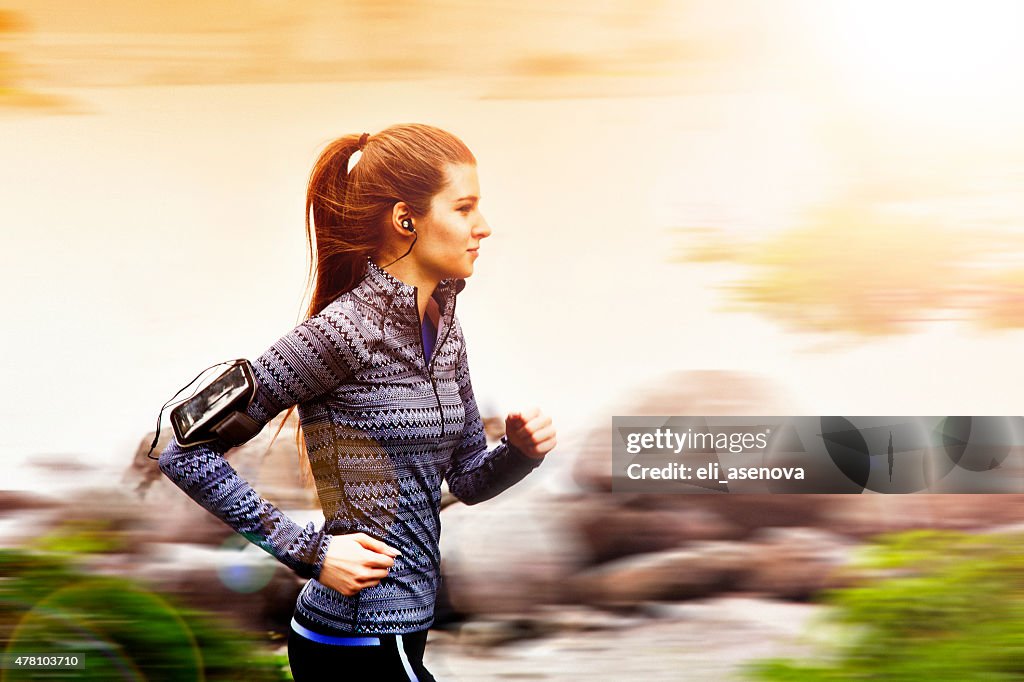 Young woman jogging in Tokyo, Japan