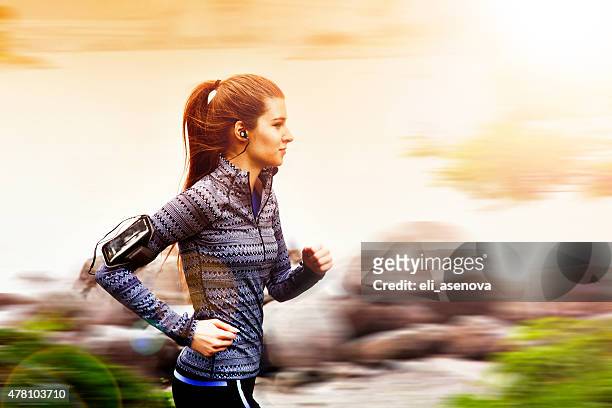 young woman jogging in tokyo, japan - skinny blonde stock pictures, royalty-free photos & images
