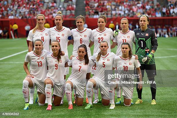 The Switzerland team pose for a team photo ahead of the FIFA Women's World Cup 2015 Round of 16 match between Canada and Switzerland at BC Place...