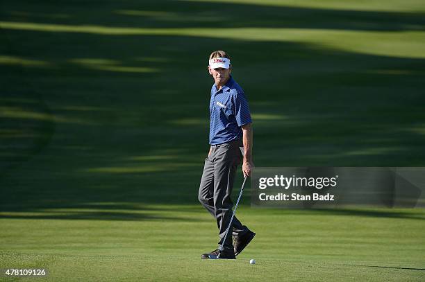 Brad Faxon studies his putt on the 18th hole during the third round of the Champions Tour Constellation SENIOR PLAYERS Championship at Belmont...