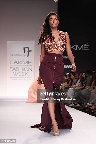 Model walks the runway wearing designs by Nikhil Thampi at day 2 of Lakme Fashion Week Summer/Resort 2014 at the Grand Hyatt on March 12, 2014 in...