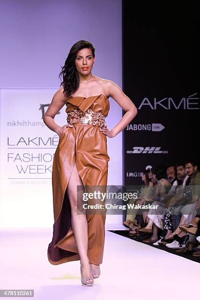 Model walks the runway wearing designs by Nikhil Thampi at day 2 of Lakme Fashion Week Summer/Resort 2014 at the Grand Hyatt on March 12, 2014 in...