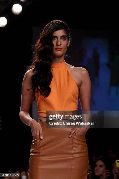 Model walks the runway wearing designs by Nikhil Thampi at day 2 of Lakme Fashion Week Summer/Resort 2014 at the Grand Hyatt on March 12, 2014 in...
