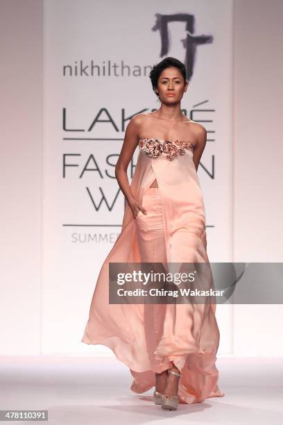 Model walks the runway wearing designs by Nikhil Thampi at day 2 of Lakme Fashion Week Summer/Resort 2014 at the Grand Hyatt on March 12, 2014 in...