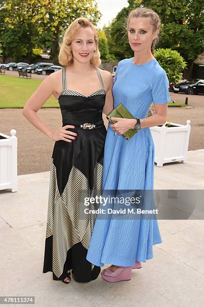 Charlotte Dellal and Laura Bailey attend The Ralph Lauren & Vogue Wimbledon Summer Cocktail Party hosted by Alexandra Shulman and Boris Becker at The...