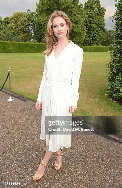 Lily James attends The Ralph Lauren & Vogue Wimbledon Summer Cocktail Party hosted by Alexandra Shulman and Boris Becker at The Orangery at...