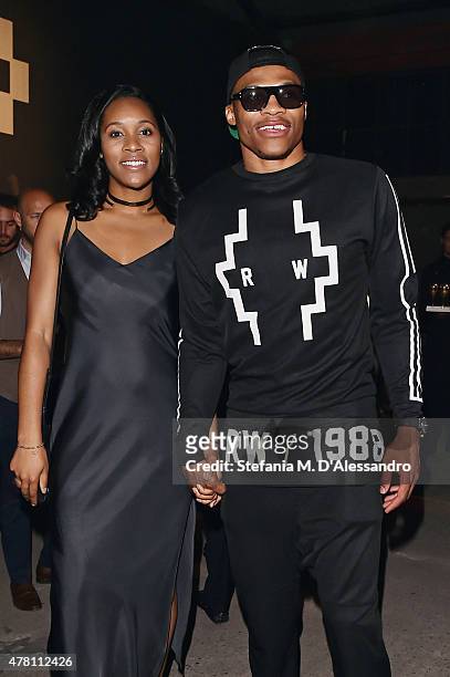 Russell Westbrook and Nina Earl attend the Marcelo Burlon County of Milan show during the Milan Men's Fashion Week Spring/Summer 2016 on June 22,...