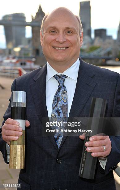 Winner of the Design of the Year 2015 and Product Design of the Year, Tony Bahinski holds his awards during the Designs of the Year Awards held at...