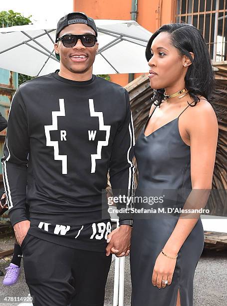 Russell Westbrook and Nina Earl attend the Marcelo Burlon County of Milan show during the Milan Men's Fashion Week Spring/Summer 2016 on June 22,...