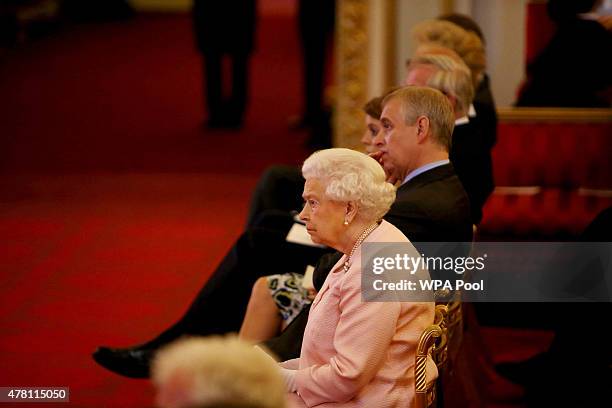 Queen Elizabeth II listens to speeches at a reception at Buckingham Palace to celebrate The Queen's Young Leaders programme and present awards to the...