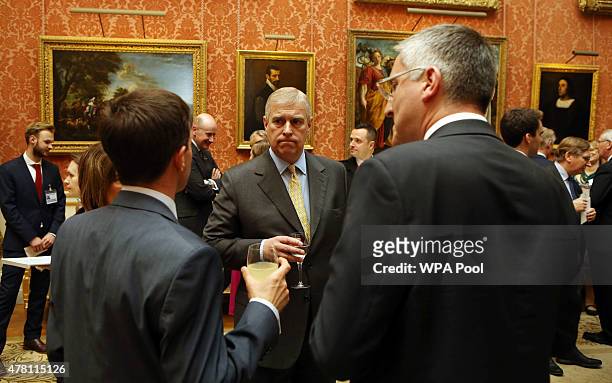 Prince Andrew, Duke of York talks to guests at a reception at Buckingham Palace to celebrate The Queen's Young Leaders programme and present awards...