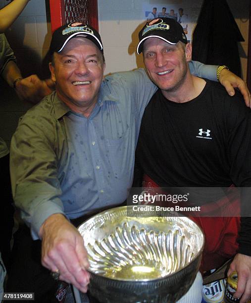 Scotty Bowman and Brett Hull of the Detroit Red Wings celebrate a Stanley Cup victory on June 14, 2002 at the Joe Louis Arena in Detroit, Michigan.