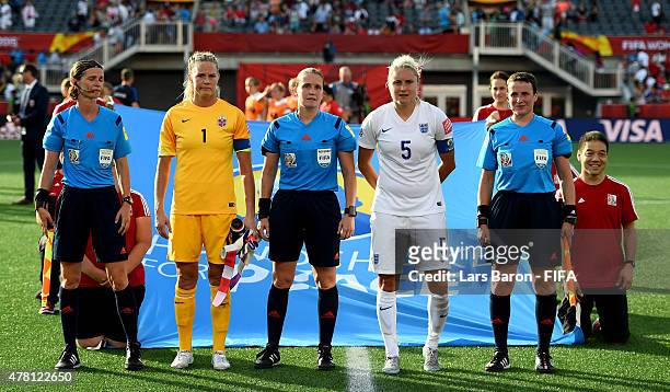Ingred Hjelmseth of Norway and Steph Houghton of England pose for a picture after the FIFA Women's World Cup 2015 Round of 16 match between Norway...