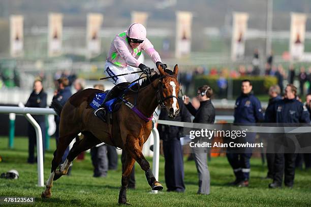 Ruby Walsh riding Faugheen clear the last to win The Neptune Investment Mamagement Novices' Hurdle Race at Cheltenham racecourse on March 12, 2014 in...