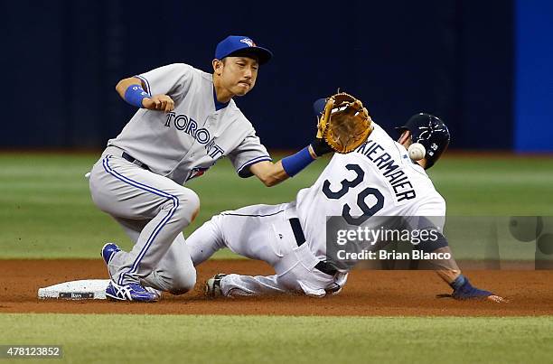 Kevin Kiermaier of the Tampa Bay Rays steals second base in front of second baseman Munenori Kawasaki of the Toronto Blue Jays during the first...