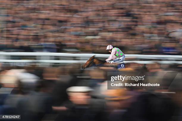 Ruby Walsh on Faugheen heads up to the finish line to win The Neptune Investment Management Novices' Hurdle during Ladies Day at the Cheltenham...