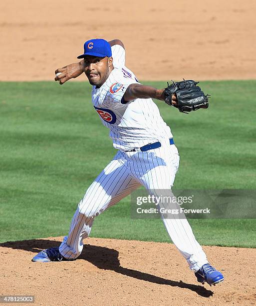 Jose Veras of the Chicago Cubs pitches against the Arizona Diamondbacks during a spring training game at Cubs Park on February 27, 2014 in Mesa,...