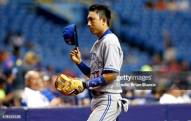 Munenori Kawasaki of the Toronto Blue Jays makes his way to the gugout following the second inning of a game against the Tampa Bay Rays on June 22,...