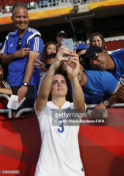 Claire Rafferty of England poses for a selfie with supporters after the FIFA Women's World Cup 2015 round of 16 match between Norway and England at...