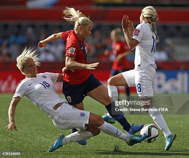 Katie Chapman and Toni Duggan of England tackle Lene Mykjaland of Norway during the FIFA Women's World Cup 2015 round of 16 match between Norway and...