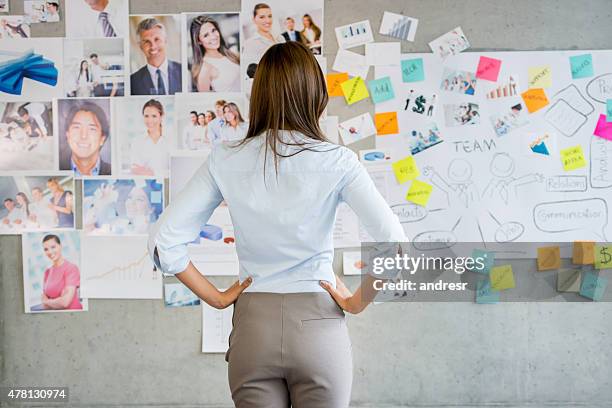 woman working in a creative business - post it board stock pictures, royalty-free photos & images