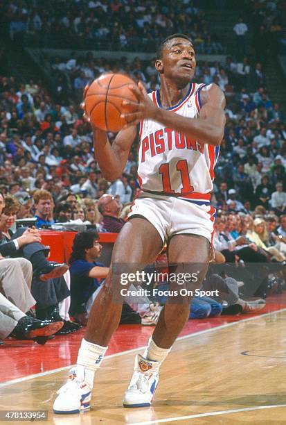 Isiah Thomas of the Detroit Pistons looks to pass the ball during an NBA basketball game circa 1989 at The Palace of Auburn Hills in Auburn Hills,...
