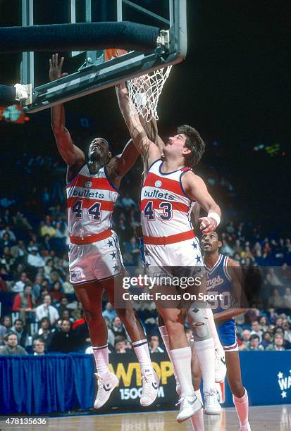 Jeff Ruland of the Washington Bullets battles for a rebound with teammate Rick Mahorn against the Kansas City Kings during an NBA basketball game...