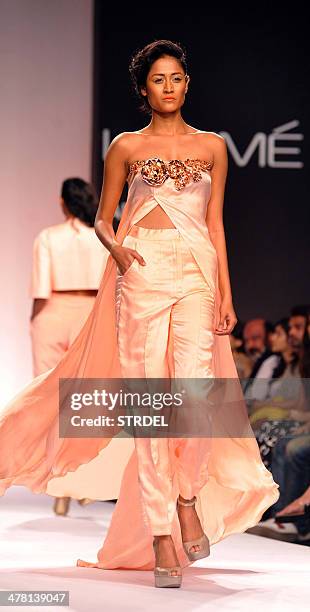 An Indian model showcases a creation by Nikhil Thampi on the second day of the Lakme Fashion Week Summer/Resort 2014 in Mumbai on March 12, 2014. AFP...