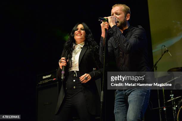 Guest vocalist Cristina Scabbia and frontman Nick Holmes of English doom metal group Paradise Lost performing live on stage at the 2013 Golden Gods...