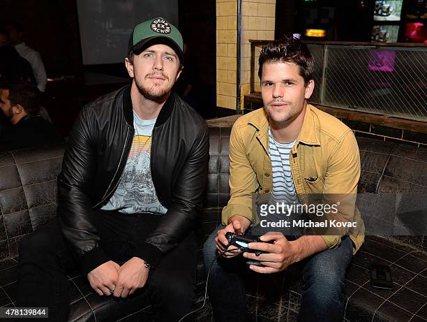 Author Pierce Brown and actor Max Carver attend the Batman: Arkham Knight VIP Launch at The Line Hotel on June 22, 2015 in Los Angeles, California.