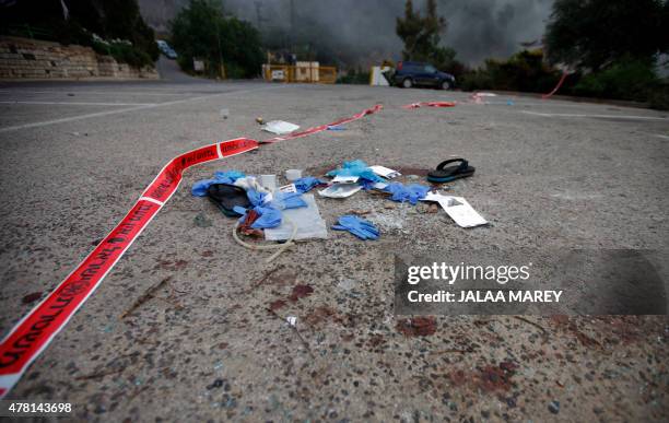 Medical gloves and material are seen lying on the floor in the Israeli settlement of Neve Ativ, near Majdal Shams on the Golan Heights, on June 23 at...