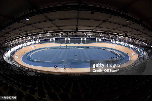 Cyclists ride in the Velodrome at the Lee Valley Velopark, formerly the cycling venue for the London 2012 Olympic Games, on March 12, 2014 in London,...