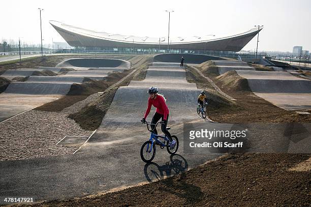 Cyclists ride the BMX track at the Lee Valley Velopark, formerly the cycling venue for the London 2012 Olympic Games, on March 12, 2014 in London,...
