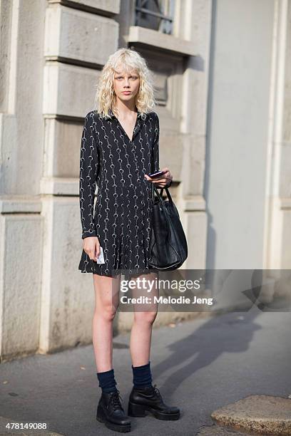 Model Marjan Jonkman exits the Prada show in a Kooples dress and Prada bag on June 21, 2015 in Milan, Italy.