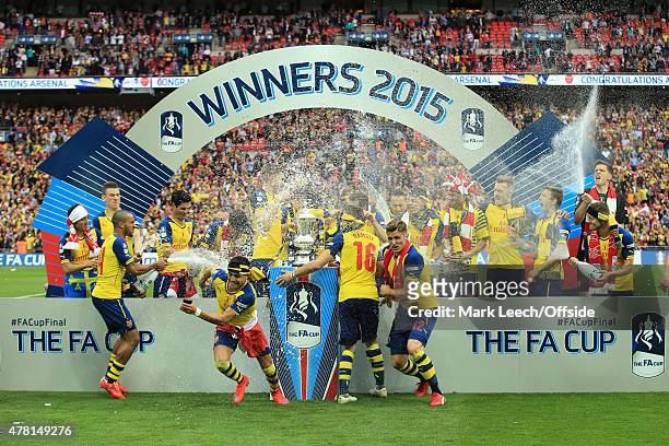 Arsenal players celebrate the FA Cup Final win between Aston Villa and Arsenal at Wembley Stadium on May 30, 2015 in London, England.Photo by Marc...