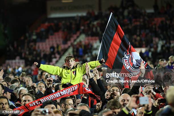 Bournemouth fans celebrate promotion to the premier league with a pitch invasion during the Sky Bet Championship match between AFC Bournemouth and...