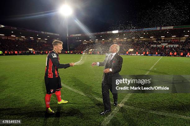 Matt Ritchie of Bournemouth sprays chairman Jeff Mostyn with champagne during the Sky Bet Championship match between AFC Bournemouth and Bolton...