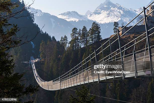 Tourists and hiker visit the sightseeing point of Castle Ehrenberg which has the longest Tibet-style suspension bridge in the world , on March 20,...