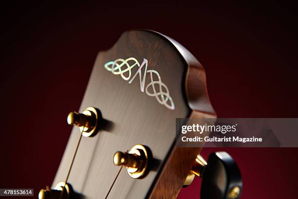 Detail of the abalone headstock inlay on an Avalon Ard Ri A3-335FC acoustic guitar, taken on November 11, 2014.