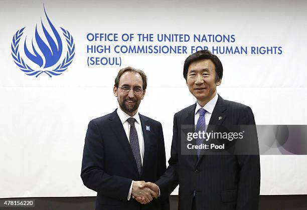 High Commissioner for Human Rights, Zeid Ra'ad Al Hussein shakes hands with South Korean Foreign Minister Yun Byung-Se during a opening ceremony of...